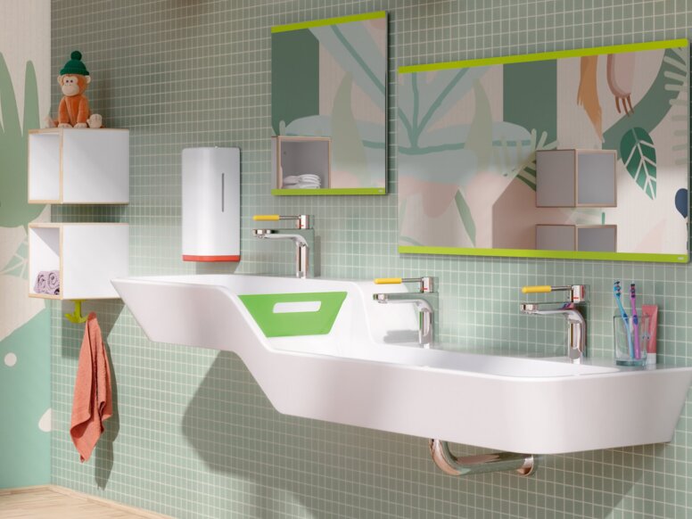 HEWI Range 477 ICONIC Interior Double washbasin with taps and two rectangular mirrors on a section of wall tiled in green in the children’s bathroom