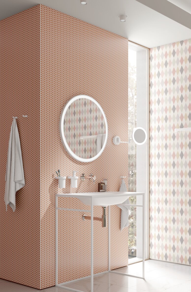 Accessibility washbasin with a robust frame that allows wheelchair access, featuring an orange-red tiled wall in the wash area