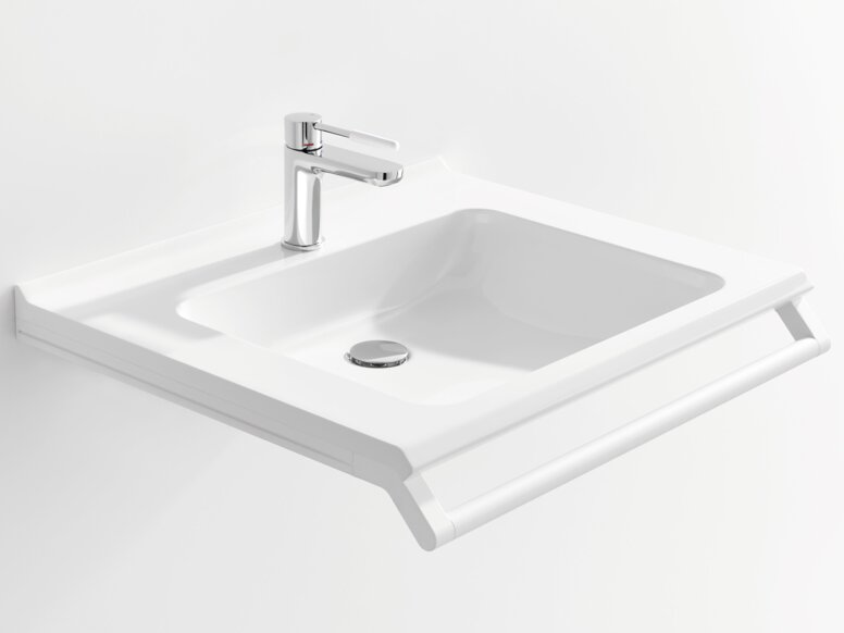 Weißer Waschtisch mit einer rechteckigen Beckenmulde, einem verchromtem Wasserhahn und einem Haltegriff an der Vorderkante