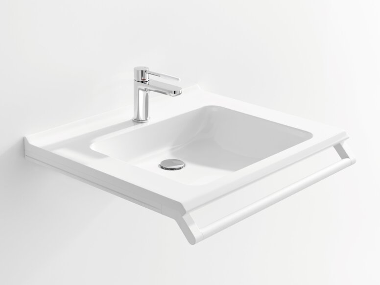 Weißer Waschtisch mit einer rechteckigen Beckenmulde, einem verchromtem Wasserhahn und einem Haltegriff an der Vorderkante